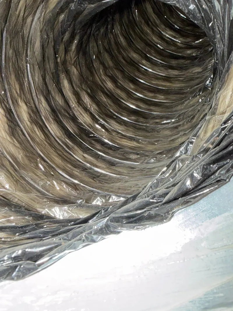 Dust and debris inside a flexible AC duct